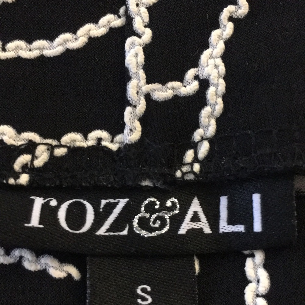 Beautiful Black Skirt with raised white flowers.